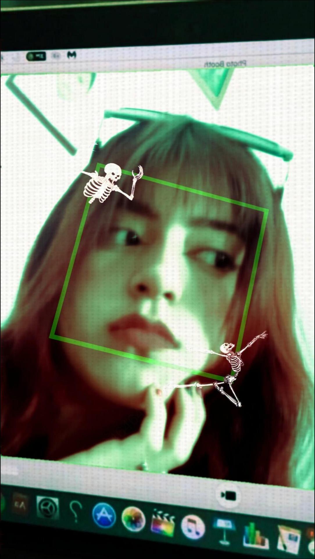 a woman is holding a computer and a cat