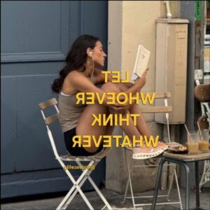 a woman is sitting on a bench with a surfboard
