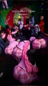 a woman is laying down on a bed with a stuffed animal