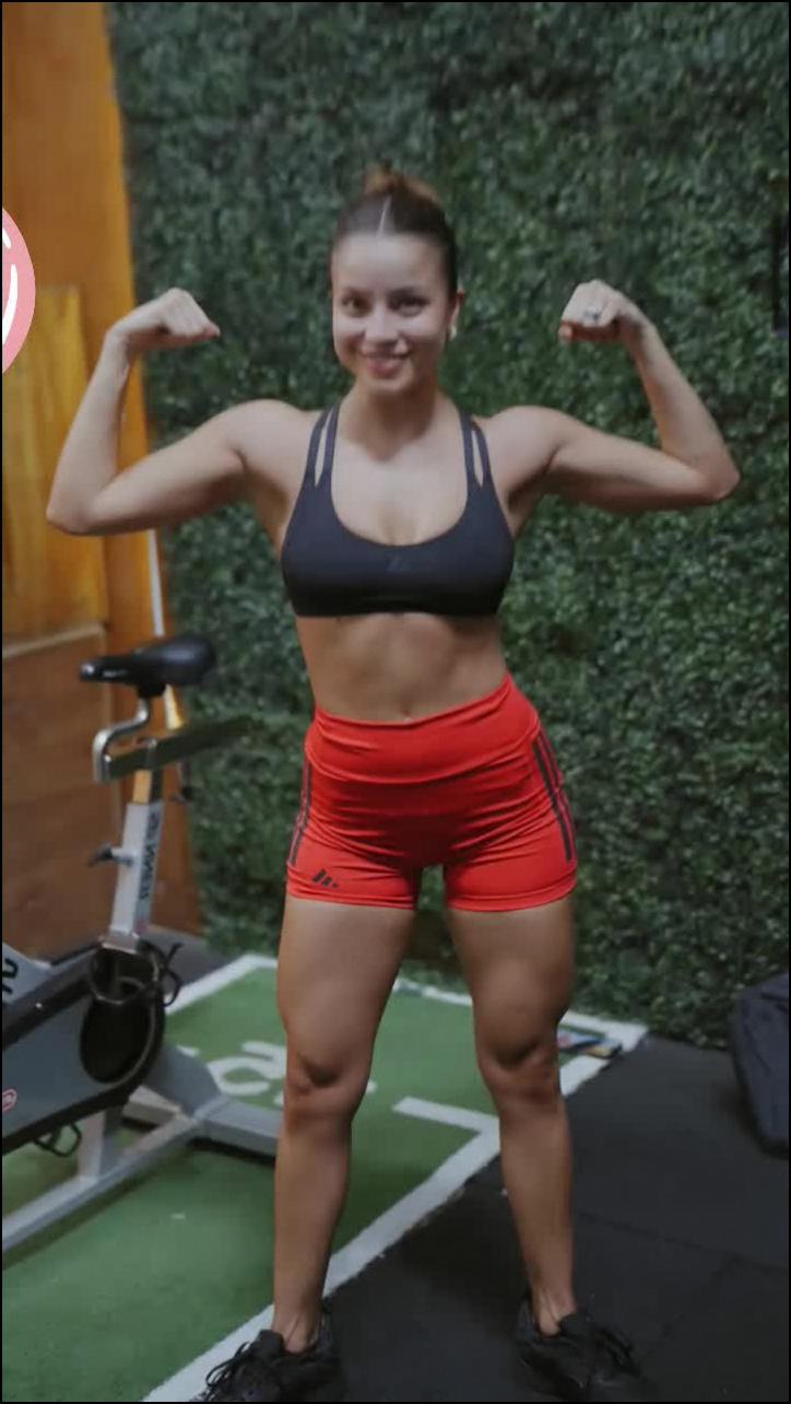 a woman in a red shirt and a red tie