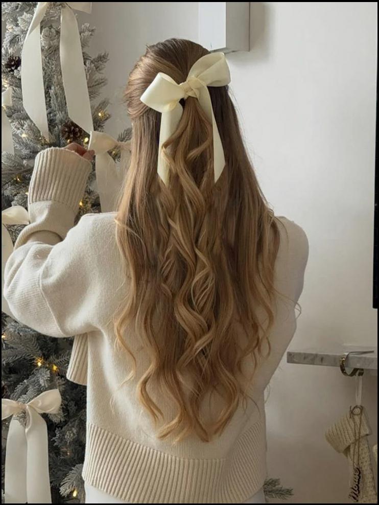 a woman wearing a white dress and a black hat