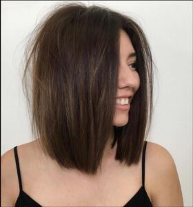 a woman is smiling and posing for a picture