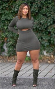 a woman in a black dress and a black skirt