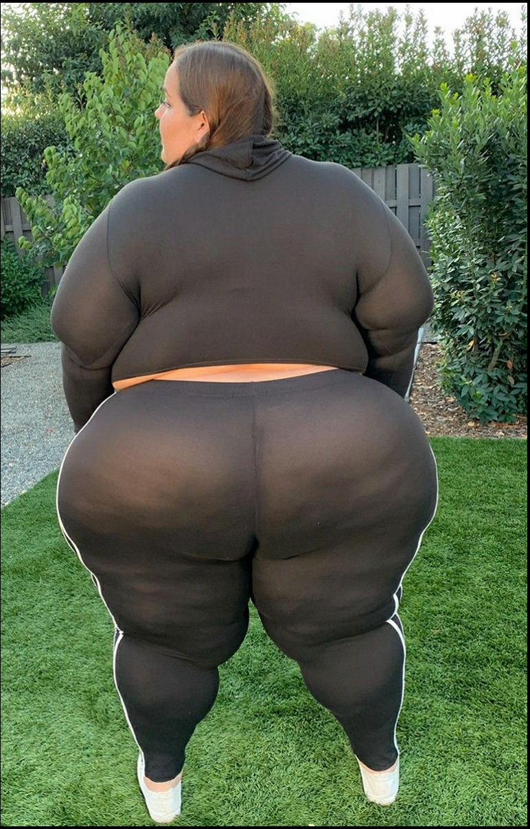 a woman is holding a large object in her hands