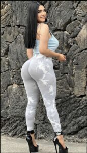 a woman in a black dress and a black skirt