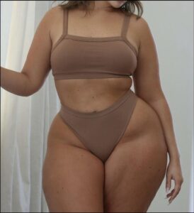 a woman in a black shirt and a black tank top