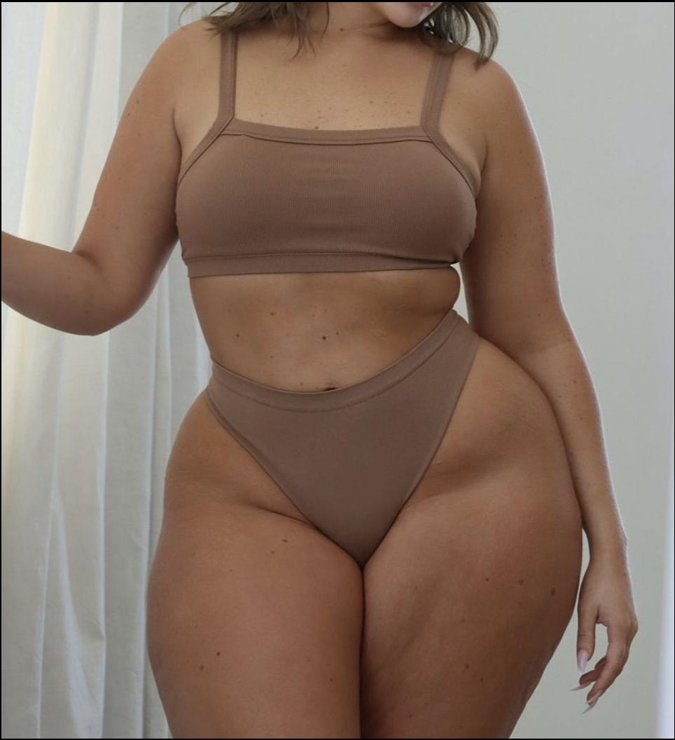 a woman in a black shirt and a black tank top