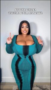 a woman in a blue shirt and a blue tie