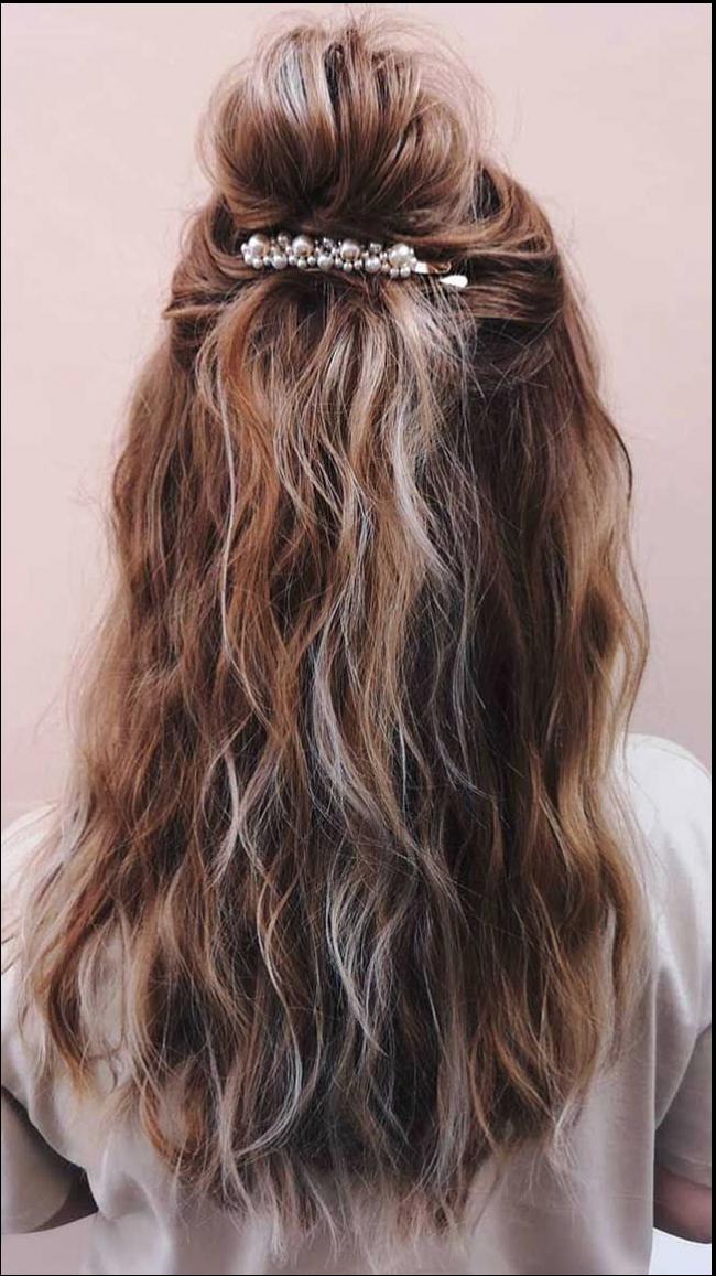 a woman is wearing a black and white striped tie