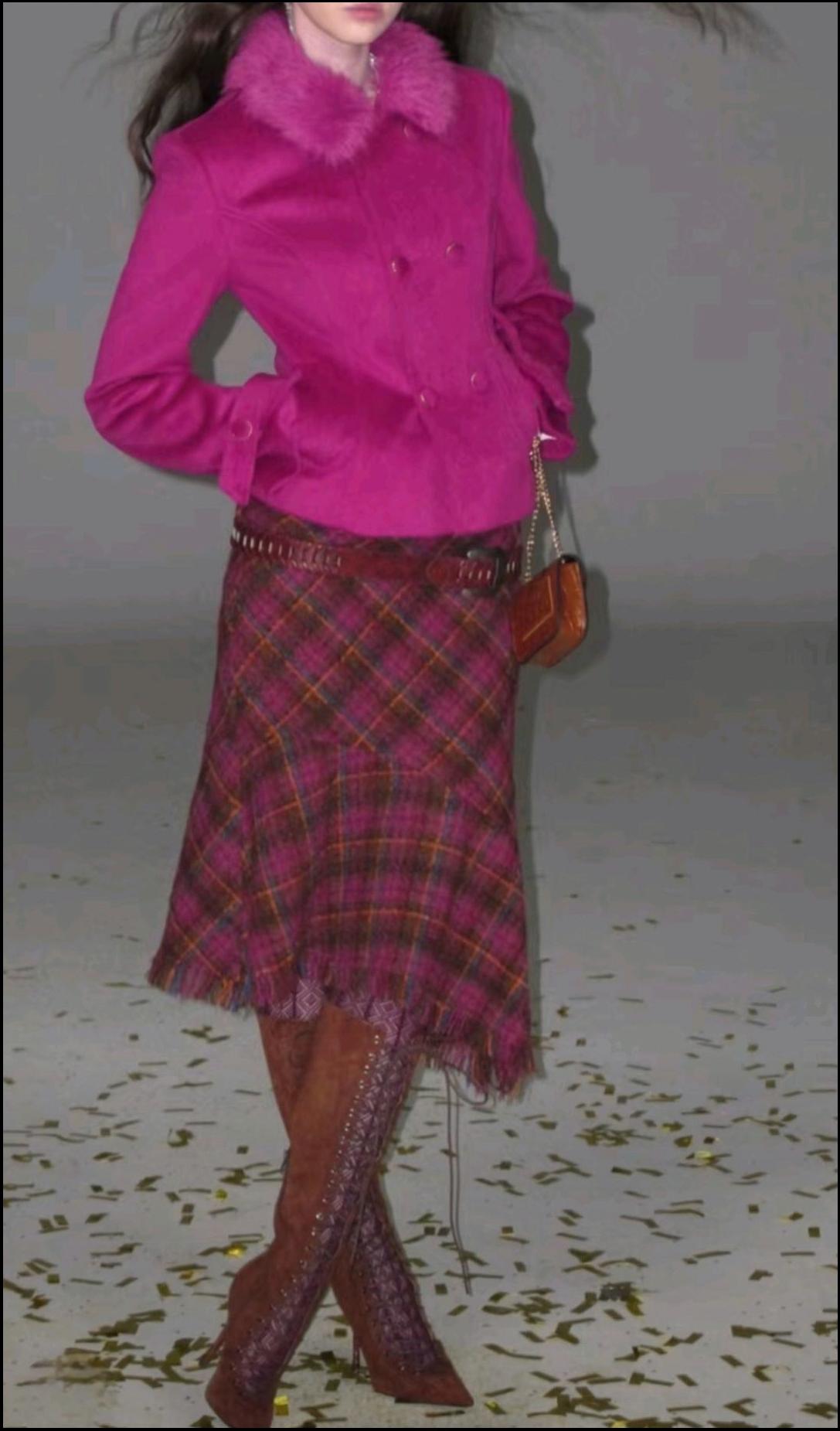 a young woman wearing a pink dress and a pink skirt