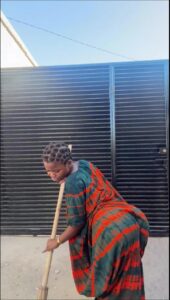 a man is holding a baseball bat on a cement block
