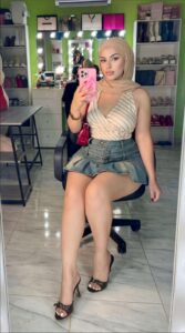 a woman is posing for a picture in a store