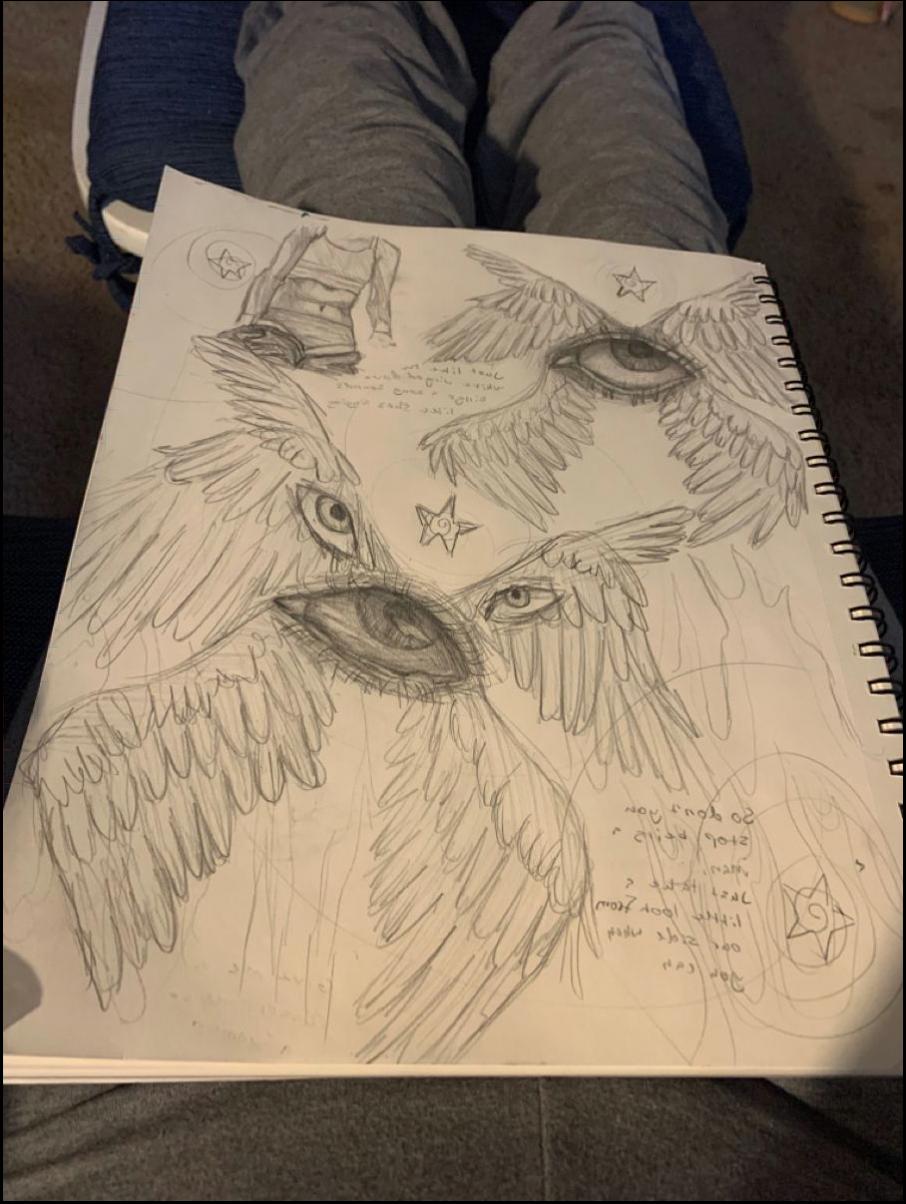 a person laying on a bed with a book