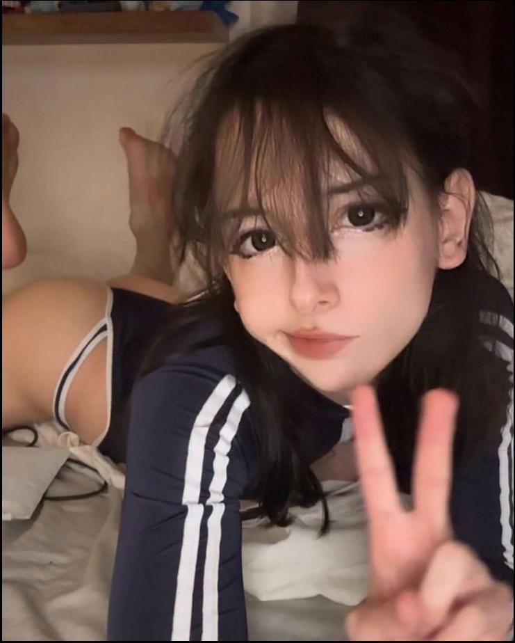 a woman with a black and white striped shirt and black pants