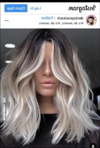 a woman with a black hair and a black tie