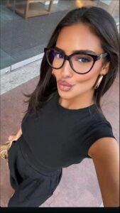 a woman with a black top and a black skirt