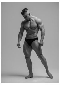 a man in a white shirt and black shorts