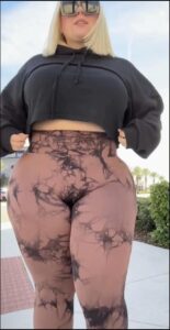 a woman in a black dress with a black headband