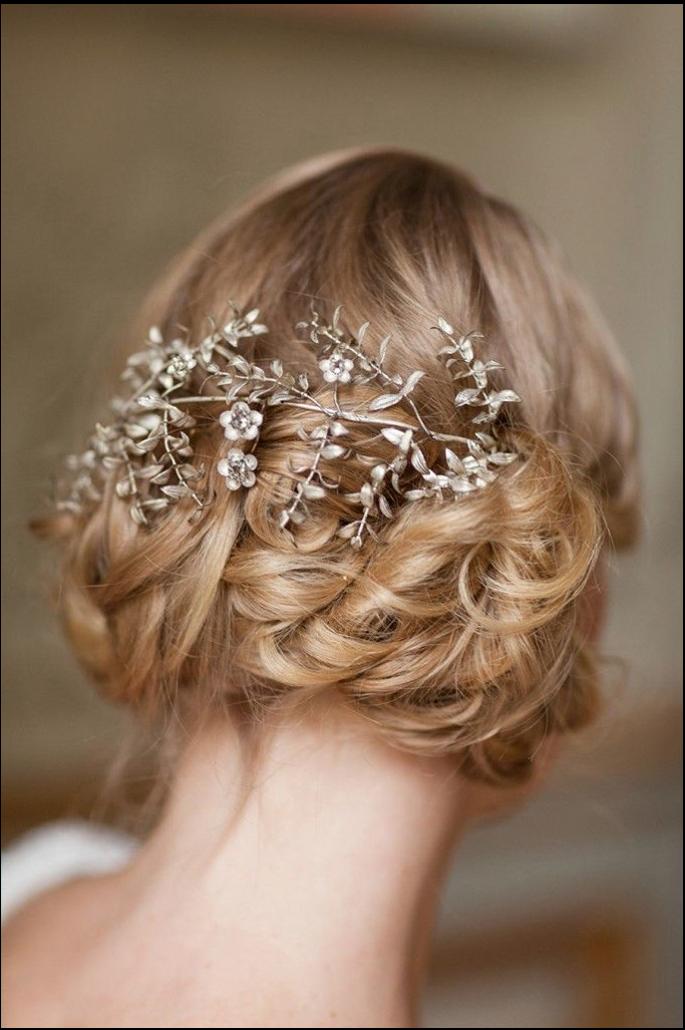 a woman in a white dress with a flower in her hair