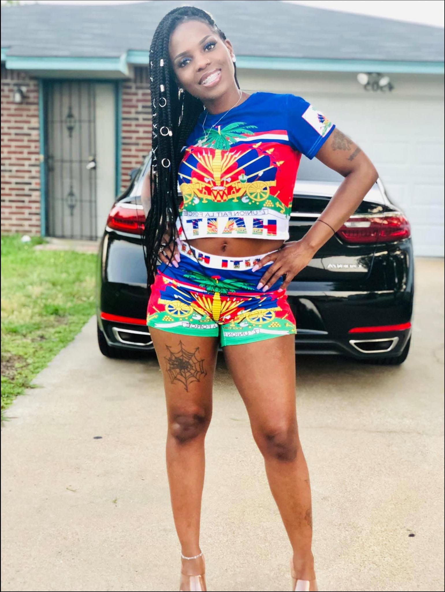 a woman in a red dress posing for a picture