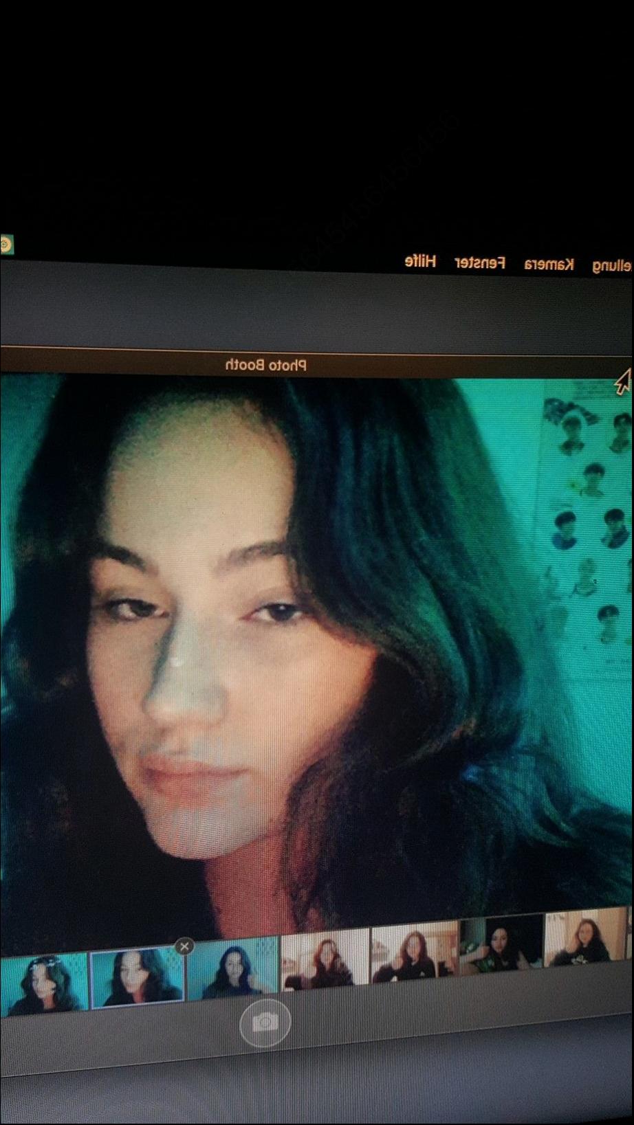 a woman is standing in front of a tv