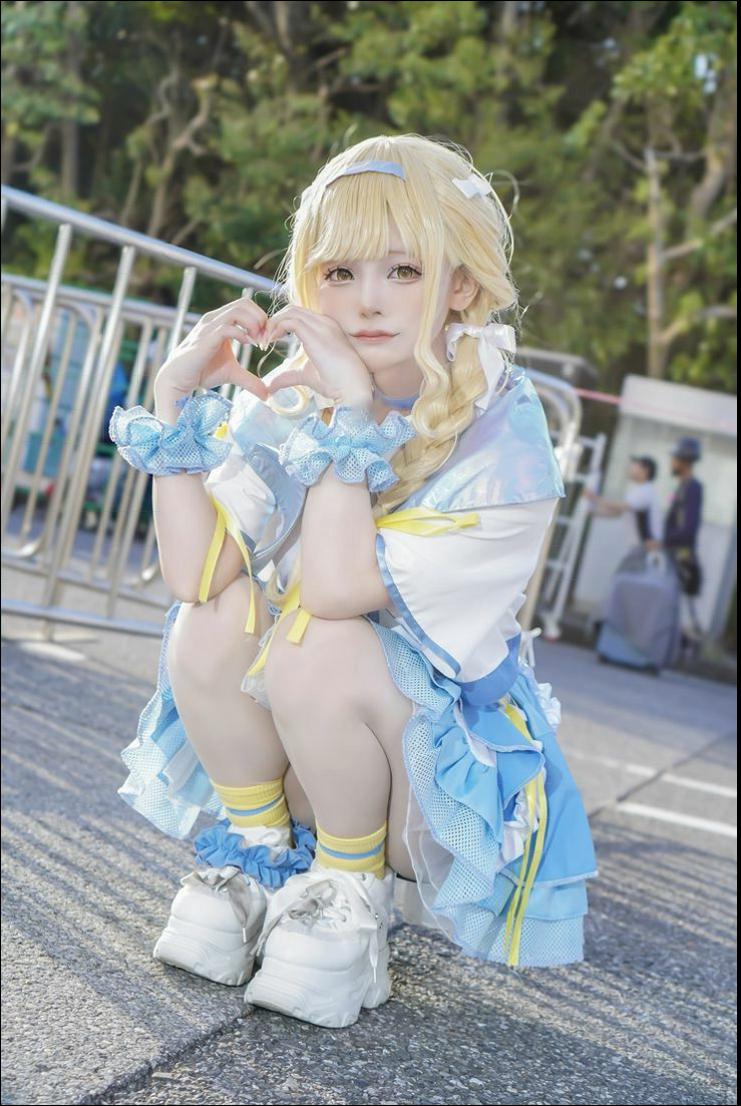 a young girl wearing a pink dress and holding a pink umbrella