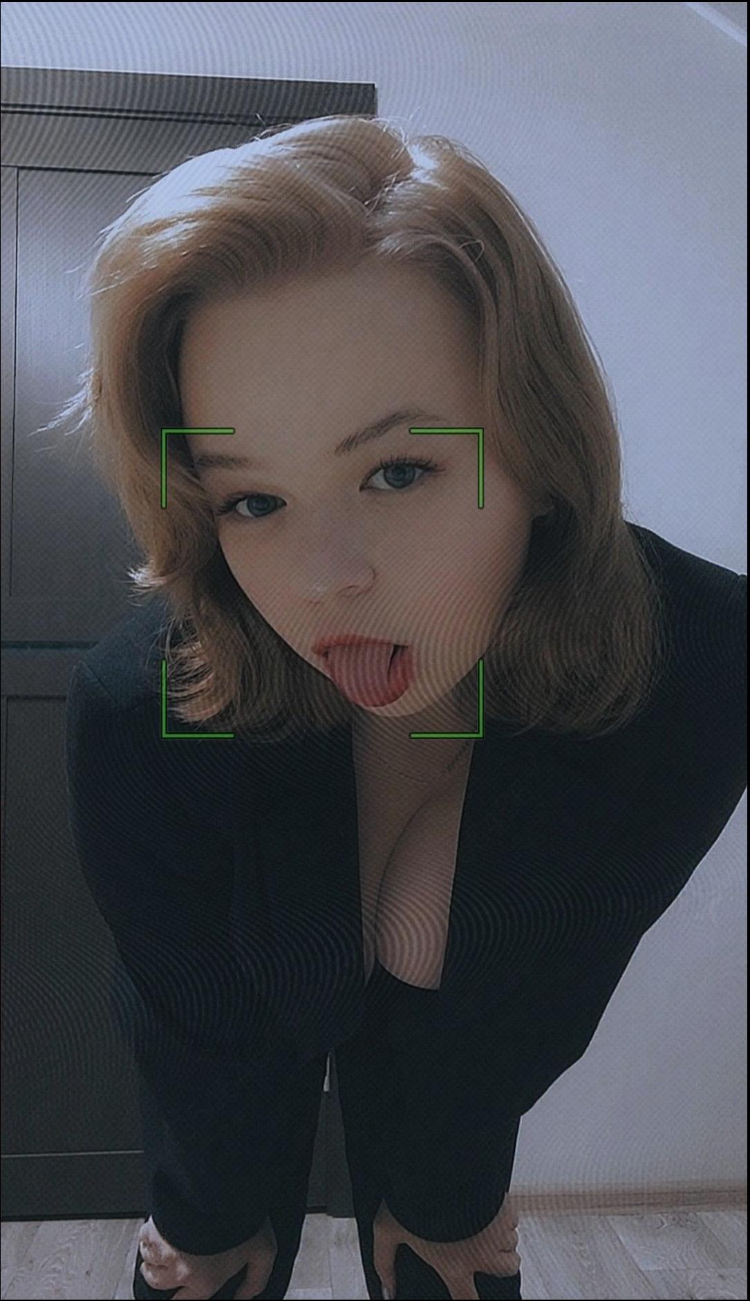 a woman with a black hair and a black tie