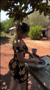 a woman is preparing food on a table