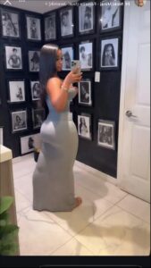 a woman is taking a picture of herself in a mirror