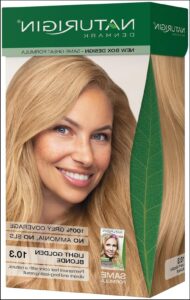 a woman is smiling and holding a sign