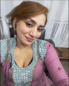 a woman is sitting in a chair with a laptop