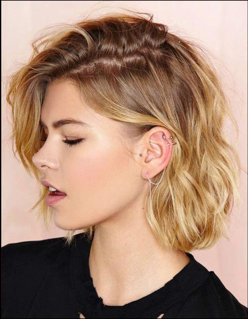 a woman is looking at the camera while wearing a black shirt