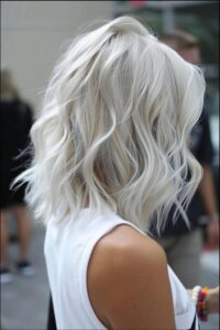 a woman with a black hair and a white shirt