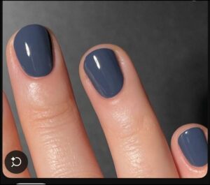 a person holding a small white and blue colored object