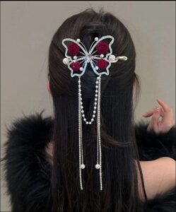 a woman wearing a red hat with a flower on it