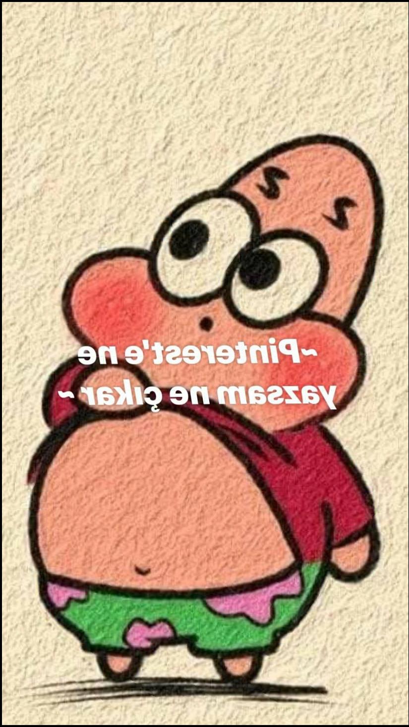 a stuffed animal on a wall with a cartoon character