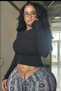 a woman in a black dress and a black skirt