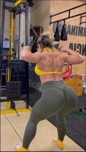 a woman is in a room with a wall