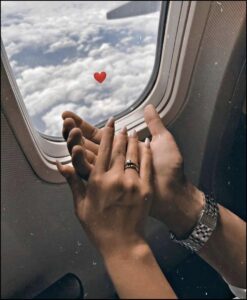 a woman is looking out the window of a train