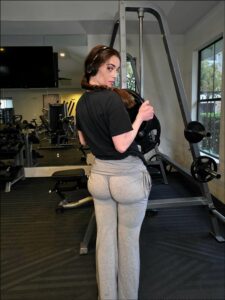 a man is holding a remote control in his hand