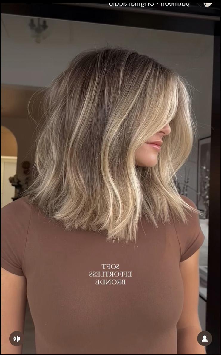 a woman with a black hair and a black tie