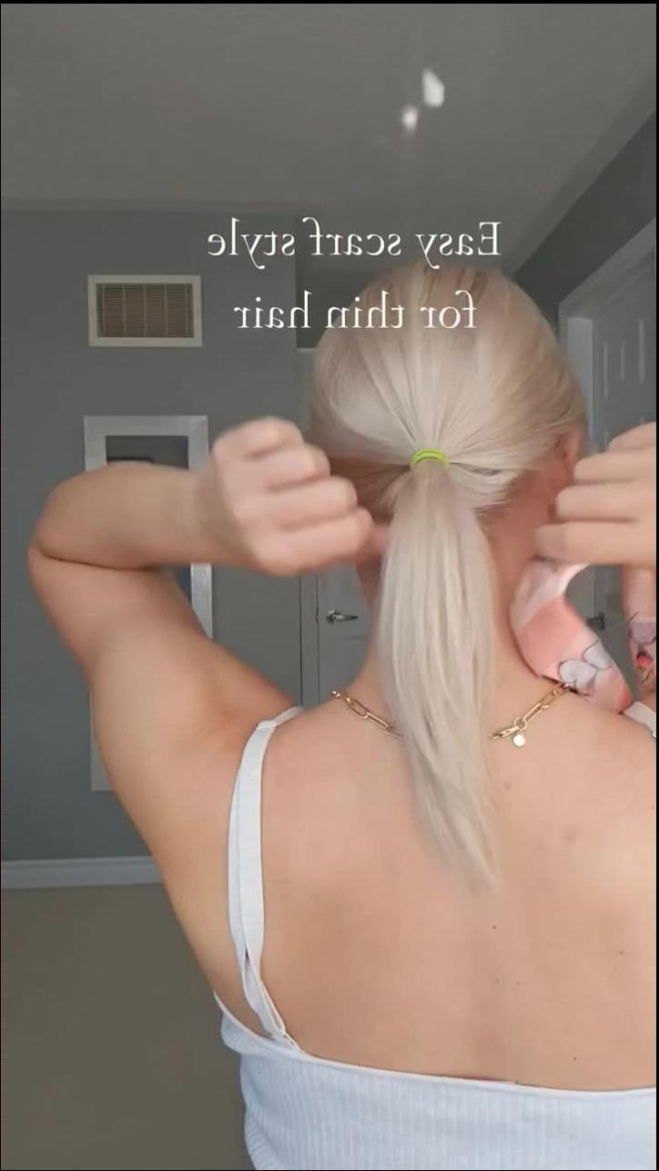 a woman is cutting a piece of paper