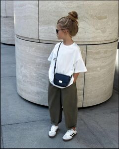 Child in White and Khaki Outfit Child in White and Khaki Outfit