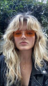 a woman with a black top and a black headband