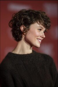 a woman is standing in a room