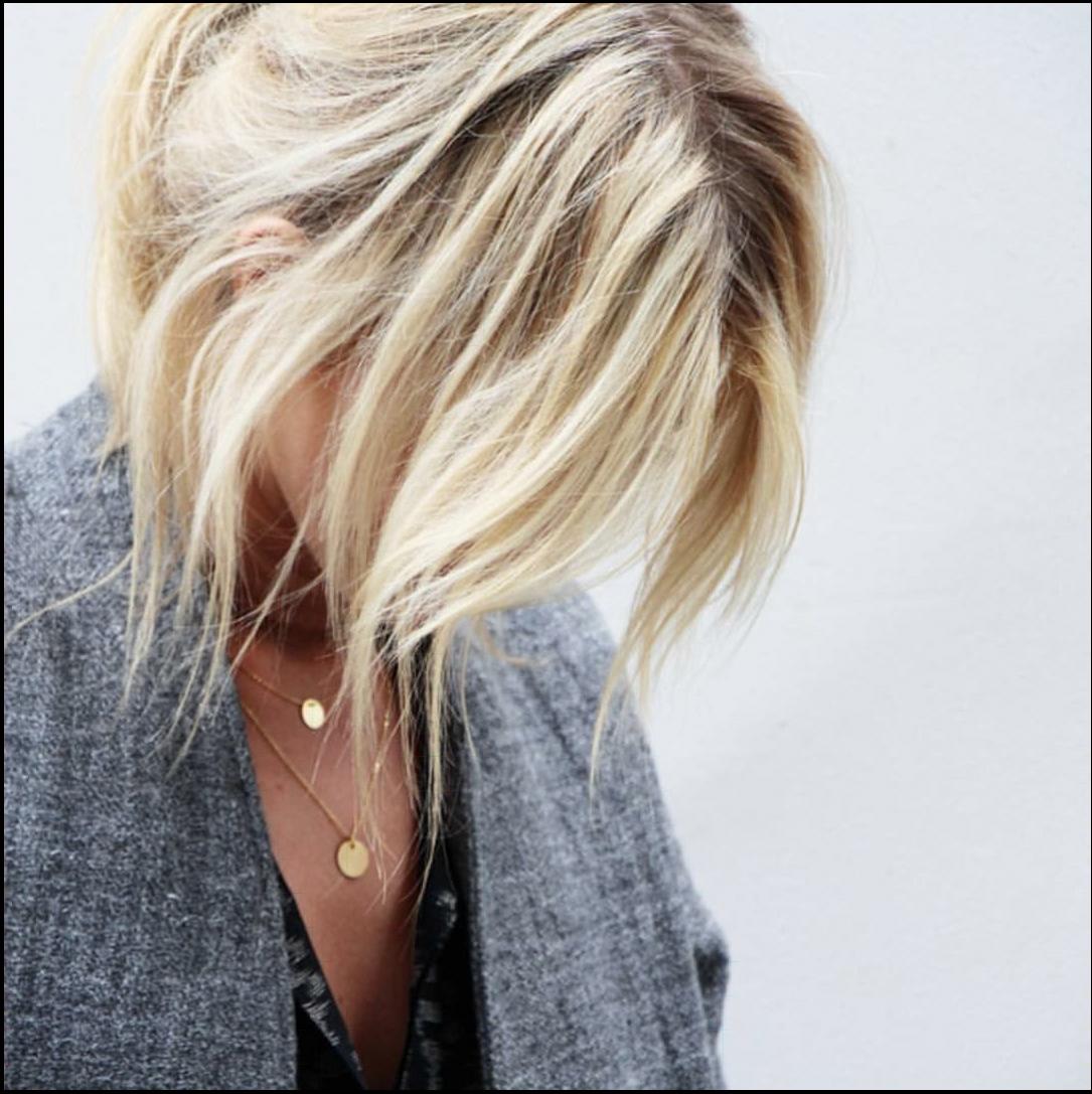 a woman with a black shirt and a black tie