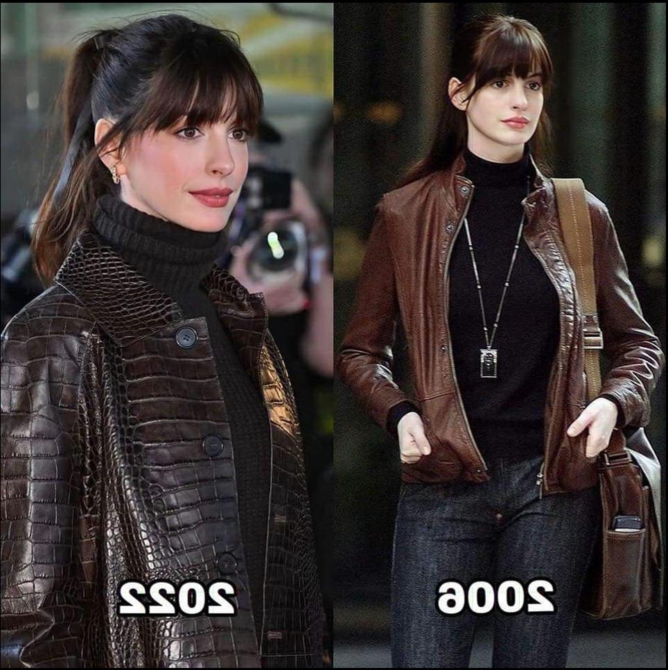 a woman is standing in a crowd of people