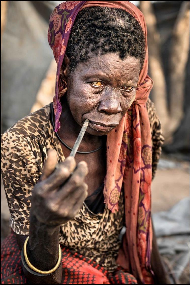 a woman with a black mask and a red head mask