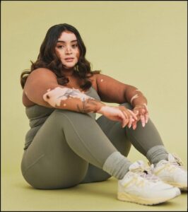 a woman is kneeling down on a floor