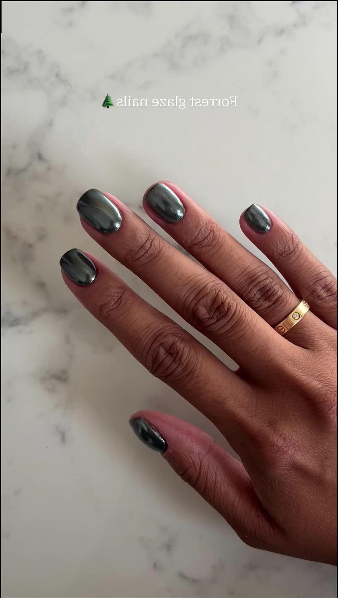 a person is holding a cell phone in one hand and a pair of scissors in the other